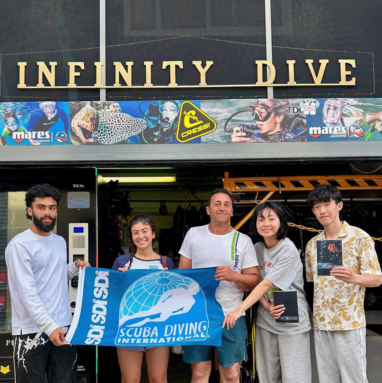 Infinity Dive students celebrating their SDI Open Water Diver graduation in Sydney.