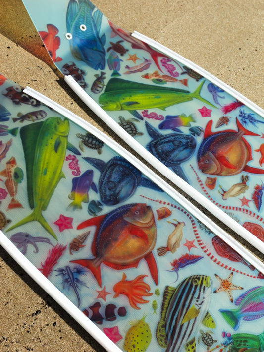 Colorful fish illustrations on a textured surface