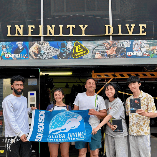 Infinity Dive students celebrating their SDI Open Water Diver graduation in Sydney.